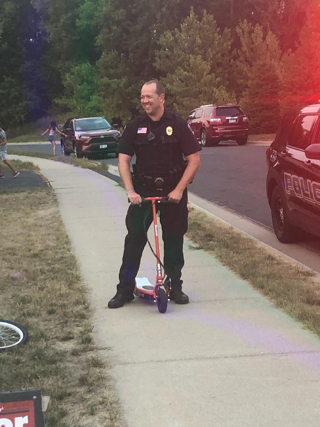 2021 Night to Unite - Officer Lilihei riding a Scooter