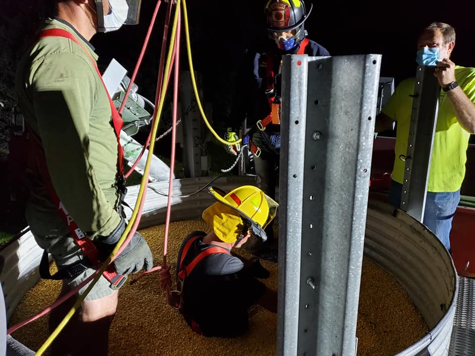 Firefighter in grains with rescue tube